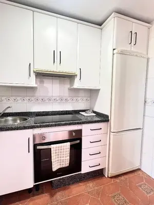 Una cocina o zona de cocina en APARTAMENTO LA MURALLA